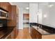 Modern kitchen featuring stainless steel appliances, wooden cabinets, and modern lighting fixtures at 943 Peachtree Ne St # 2009, Atlanta, GA 30309