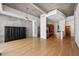 Spacious living room with hardwood floors, concrete walls, and modern ceiling fan at 943 Peachtree Ne St # 2009, Atlanta, GA 30309