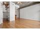 Expansive open living room with exposed concrete ceiling and a large blank wall for customization at 943 Peachtree Ne St # 2009, Atlanta, GA 30309