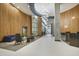 Stylish building lobby with modern lighting fixtures, wood paneling, and comfortable seating areas for residents at 943 Peachtree Ne St # 2009, Atlanta, GA 30309