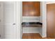 Small office space with built-in desk, granite top, and overhead storage cabinets at 943 Peachtree Ne St # 2009, Atlanta, GA 30309