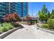 Condo's outdoor patio with lush landscaping and dining area, perfect for relaxing and entertaining at 943 Peachtree Ne St # 2009, Atlanta, GA 30309