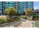 Condo's outdoor patio with lush landscaping and dining area, perfect for relaxing and entertaining at 943 Peachtree Ne St # 2009, Atlanta, GA 30309