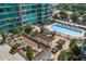 Outdoor swimming pool and lounge area surrounded by lush greenery, offering a relaxing retreat at 943 Peachtree Ne St # 2009, Atlanta, GA 30309