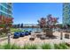Condo patio area boasts a pool with lounge chairs, tables, chairs and garden area, perfect for relaxing and entertaining at 943 Peachtree Ne St # 2009, Atlanta, GA 30309