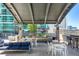 Condo patio area features comfortable seating, dining area and a grill, perfect for relaxing and entertaining at 943 Peachtree Ne St # 2009, Atlanta, GA 30309