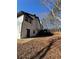 A home's backyard featuring a wooden deck, siding, and a door that provides convenient outdoor access at 2520 Deerfield Nw Dr, Kennesaw, GA 30144