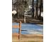 Community basketball court with new blue surface and partially fenced area at 2520 Deerfield Nw Dr, Kennesaw, GA 30144