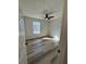 Cozy bedroom features new floor, fan and window overlooking yard at 2520 Deerfield Nw Dr, Kennesaw, GA 30144