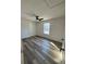 Bright bedroom showcases fan and window, new floor, and white walls at 2520 Deerfield Nw Dr, Kennesaw, GA 30144
