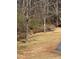 Back yard with creek located near the basketball court in the neighborhood at 2520 Deerfield Nw Dr, Kennesaw, GA 30144