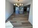 Open concept living space with kitchen, dining, and living room with fireplace at 2520 Deerfield Nw Dr, Kennesaw, GA 30144