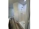 Bright bathroom featuring a walk-in shower with tiled walls, and updated fixtures at 2520 Deerfield Nw Dr, Kennesaw, GA 30144
