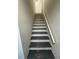 Stairway with painted steps and handrail at 2520 Deerfield Nw Dr, Kennesaw, GA 30144