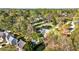 An aerial perspective shows a residential area with varying rooftops and verdant trees and lawns at 409 Shannon Way, Lawrenceville, GA 30044