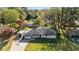 Beautiful aerial view of property with large yard, mature trees, and a carport at 409 Shannon Way, Lawrenceville, GA 30044