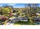 Aerial shot of the home, long driveway, carport, shed, and surrounding greenery at 409 Shannon Way, Lawrenceville, GA 30044