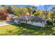 Wide aerial shot of the property, showcasing the home, carport, and spacious yard at 409 Shannon Way, Lawrenceville, GA 30044