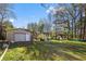 Backyard featuring a detached garage and plenty of green space at 409 Shannon Way, Lawrenceville, GA 30044