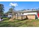 Cozy backyard with a wooden deck, small storage shed and a lush lawn at 409 Shannon Way, Lawrenceville, GA 30044