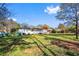 Lush backyard featuring a well-maintained lawn and partially covered patio, perfect for outdoor relaxation at 409 Shannon Way, Lawrenceville, GA 30044