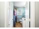 Compact bathroom with a shower curtain, tiled floors, and a single sink vanity at 409 Shannon Way, Lawrenceville, GA 30044