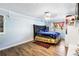 Charming bedroom showcases a modern bedframe and wood flooring at 409 Shannon Way, Lawrenceville, GA 30044