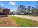 View of the home's inviting exterior, complete with a long driveway and well-maintained front yard at 409 Shannon Way, Lawrenceville, GA 30044