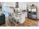 Open kitchen with stainless steel appliances, kitchen island and lots of storage at 409 Shannon Way, Lawrenceville, GA 30044