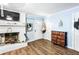 Inviting living room with a traditional fireplace and natural light at 409 Shannon Way, Lawrenceville, GA 30044