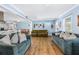 Inviting living room with hardwood floors, cozy sofas, and an open layout perfect for entertaining at 409 Shannon Way, Lawrenceville, GA 30044