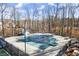 Community pool covered for the off-season adjacent to a tennis court with perimeter fencing at 2720 Araglin Dr, Dacula, GA 30019