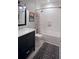 Modern bathroom featuring a vanity, white subway tile, and a patterned shower curtain at 2928 Lavista Rd, Decatur, GA 30033