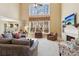 Bright living room featuring large windows, a fireplace, and an open floor plan at 4543 Fairecroft Ter, Suwanee, GA 30024