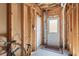 Mud room with utility sink, access doors, and wooden framing at 4543 Fairecroft Ter, Suwanee, GA 30024