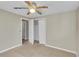 Neutral bedroom with carpet and white trim, with a view to a closet and hallway at 6198 Rocky Creek Dr, Douglasville, GA 30135