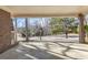 The property's covered carport features brick columns and an open view of the neighborhood street at 6198 Rocky Creek Dr, Douglasville, GA 30135
