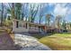 Charming single-story home featuring a brick facade, front porch, and well-maintained lawn, blending classic charm with modern comfort at 2084 Snow Sw Rd, Atlanta, GA 30311