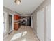Functional kitchen featuring dark cabinetry, appliances, laminate countertops, and tile flooring at 2084 Snow Sw Rd, Atlanta, GA 30311