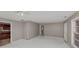 Living room view of ceiling fan, entry and an adjacent kitchen at 2084 Snow Sw Rd, Atlanta, GA 30311