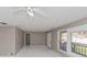 Light-filled living room features ceiling fan, and large window views at 2084 Snow Sw Rd, Atlanta, GA 30311