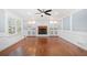 Living room features a fireplace, built-in shelving and hardwood floors at 2938 Thornridge Dr, Atlanta, GA 30340