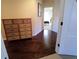 Hallway with hardwood floors and a dresser at 3600 Ridge Grove Trl, Suwanee, GA 30024