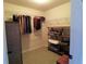 Carpeted walk-in closet with shelving and hanging rods at 3600 Ridge Grove Trl, Suwanee, GA 30024