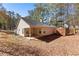 Backyard view featuring a covered patio and storage shed at 5336 Monticello Dr, Villa Rica, GA 30180