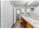 Bathroom featuring double sinks, a mirror, and storage cabinets at 5336 Monticello Dr, Villa Rica, GA 30180