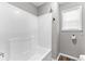 Bathroom featuring a white bathtub and tiled walls at 5336 Monticello Dr, Villa Rica, GA 30180