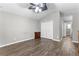 Bedroom featuring wood floors, ceiling fan, and double-door closet at 5336 Monticello Dr, Villa Rica, GA 30180