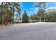 A traditional home featuring a well-maintained lawn with mature trees at 5336 Monticello Dr, Villa Rica, GA 30180