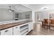 Kitchen featuring a breakfast bar with wood countertop and seating area with natural light at 5336 Monticello Dr, Villa Rica, GA 30180